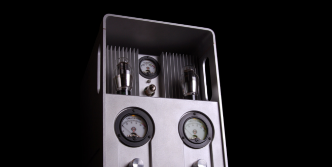 Grey tube amplifier with a black background.