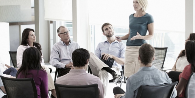 People listening to a speaker speaking