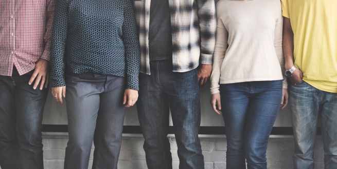 Five adults in casual clothing